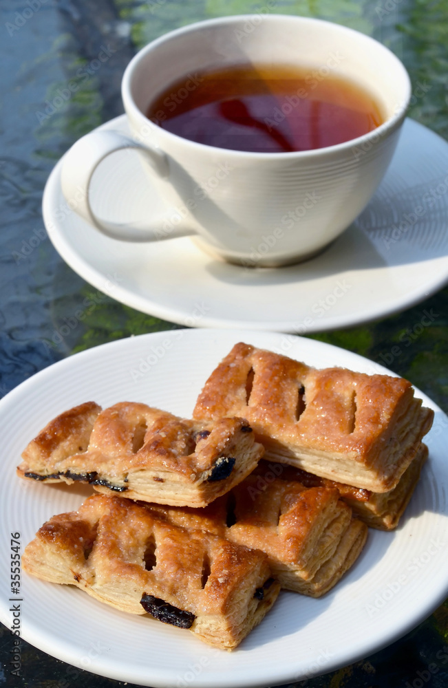 Tea Break with raisin pie biscuits in morning light Tea Break with raisin pie biscuits in morning light