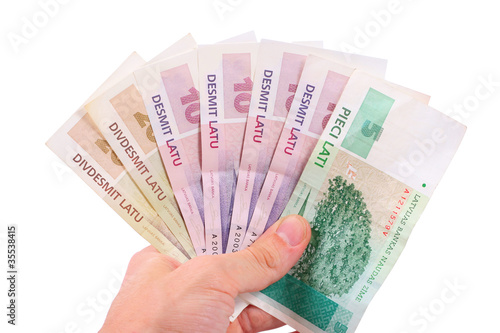 hand with latvian money