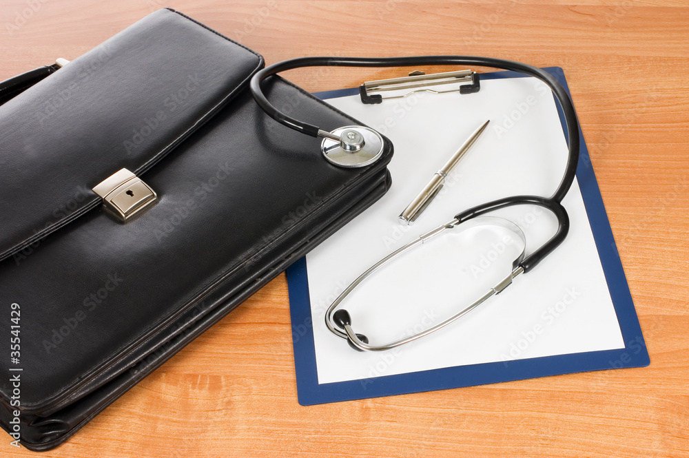 Black portfolio and phonendoscope on white Black portfolio and phonendoscope on white