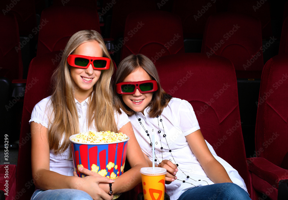Two young girls in cinema Two young girls in cinema