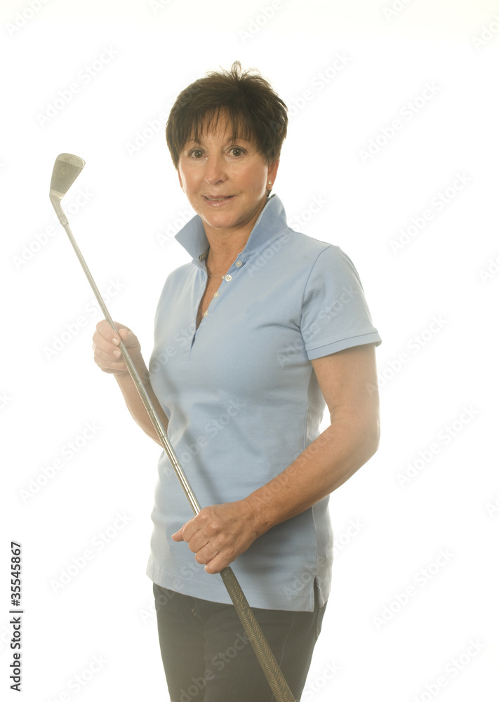 female middle age senior woman athlete with gold iron club female middle age senior woman athlete with gold iron club