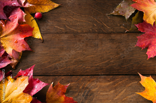 Slika na platnu yellow  autumn leaves on background old wood