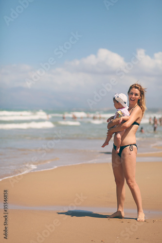 Mother and baby by the sea