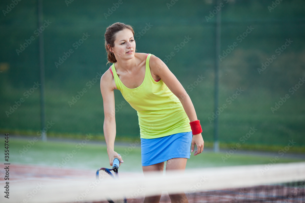 pretty, young female tennis player on the tennis court pretty, young female tennis player on the tennis court