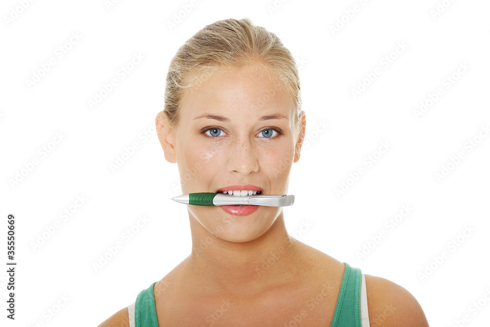 Teen woman with pen. Teen woman with pen.