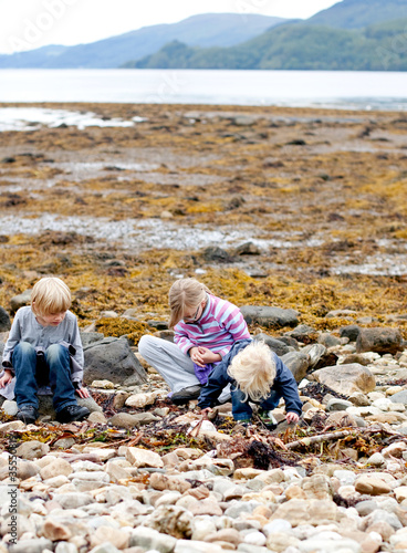 Children exploring a scottish beach