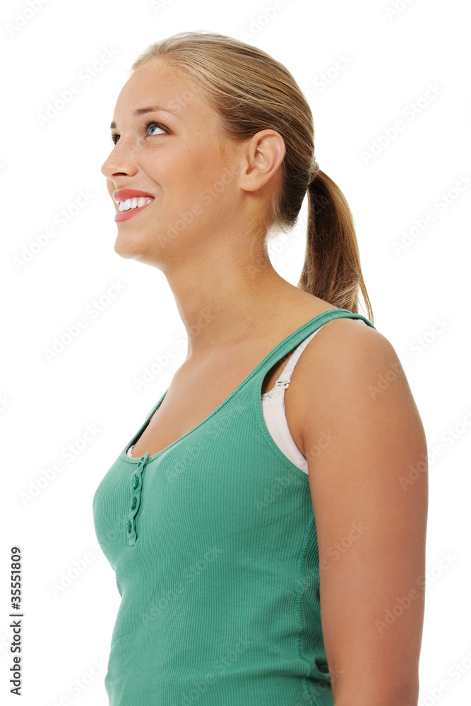 Side view of happy attractive female looking up Side view of happy attractive female looking up
