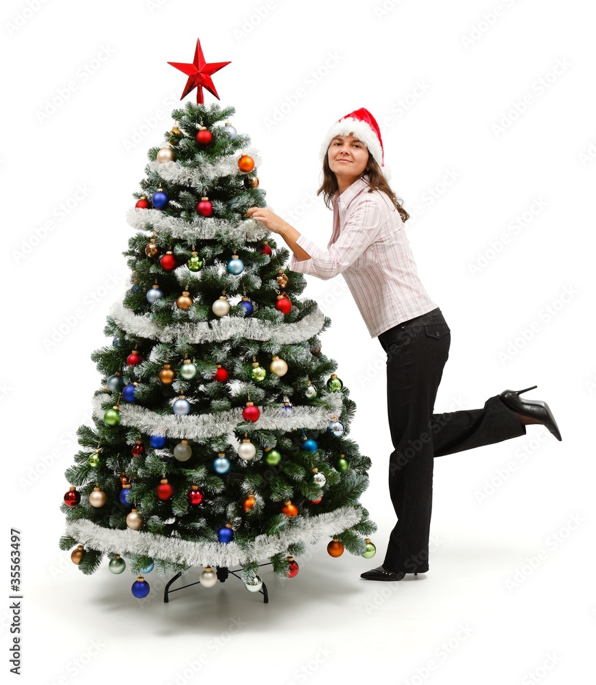 Woman standing near decorated Christmas tree Woman standing near decorated Christmas tree