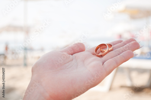 wedding rings in the hands of women
