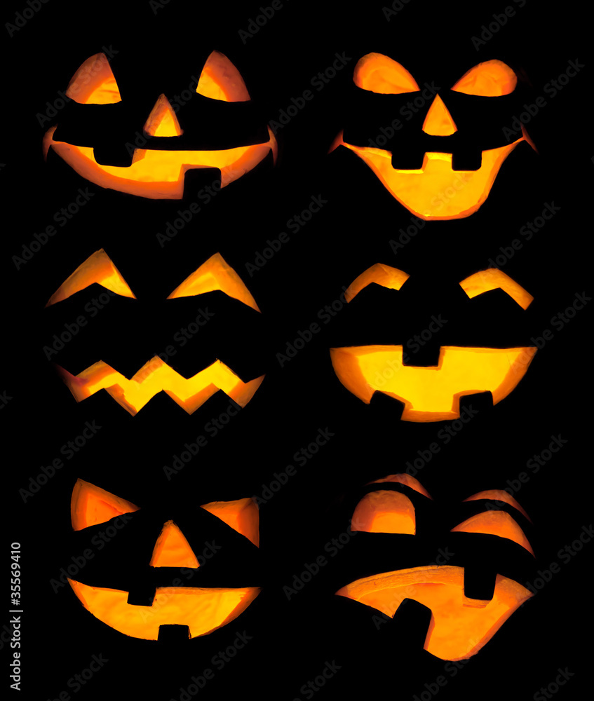 Carved Jack-o-lanterns lit for Halloween Carved Jack-o-lanterns lit for Halloween