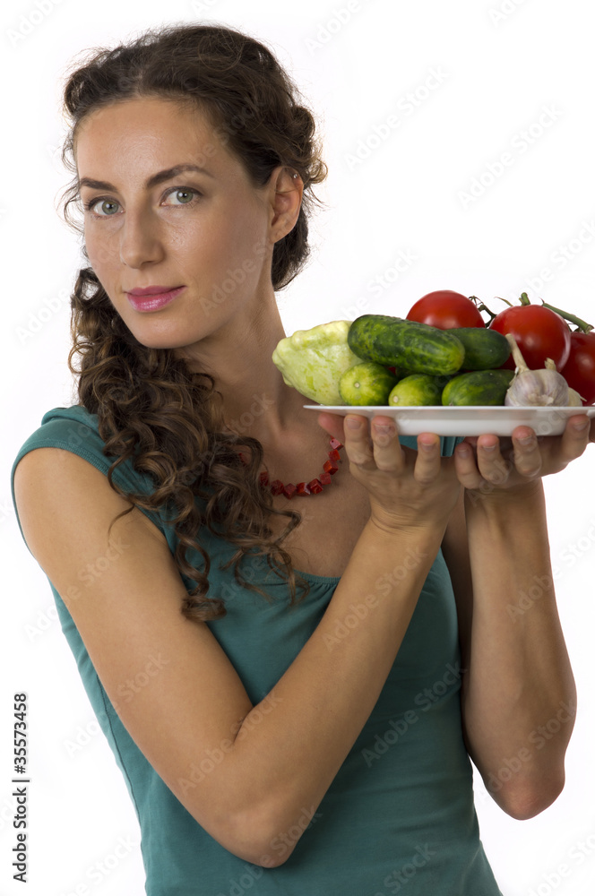 Girl with vegetables in your hands Girl with vegetables in your hands