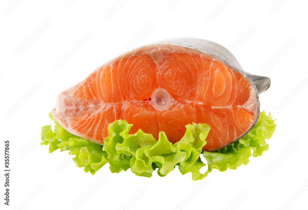 Salmon steak with greens isolated on white Salmon steak with greens isolated on white