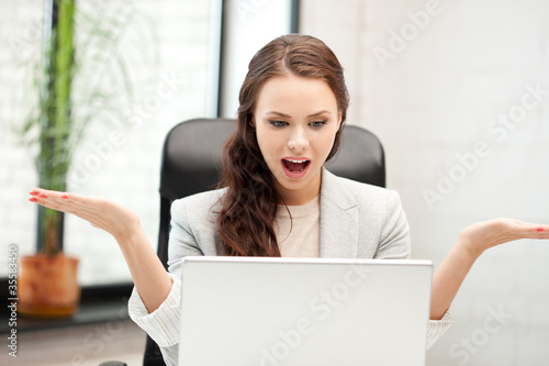 happy woman with laptop computer