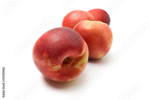 Peaches isolated on the white background