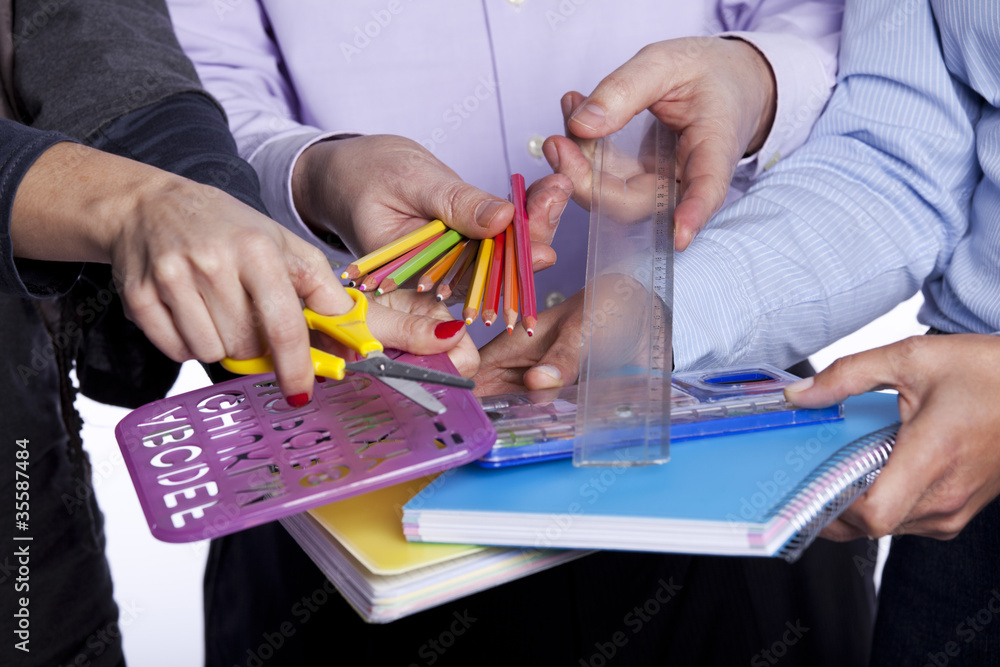 Hands holding education objects