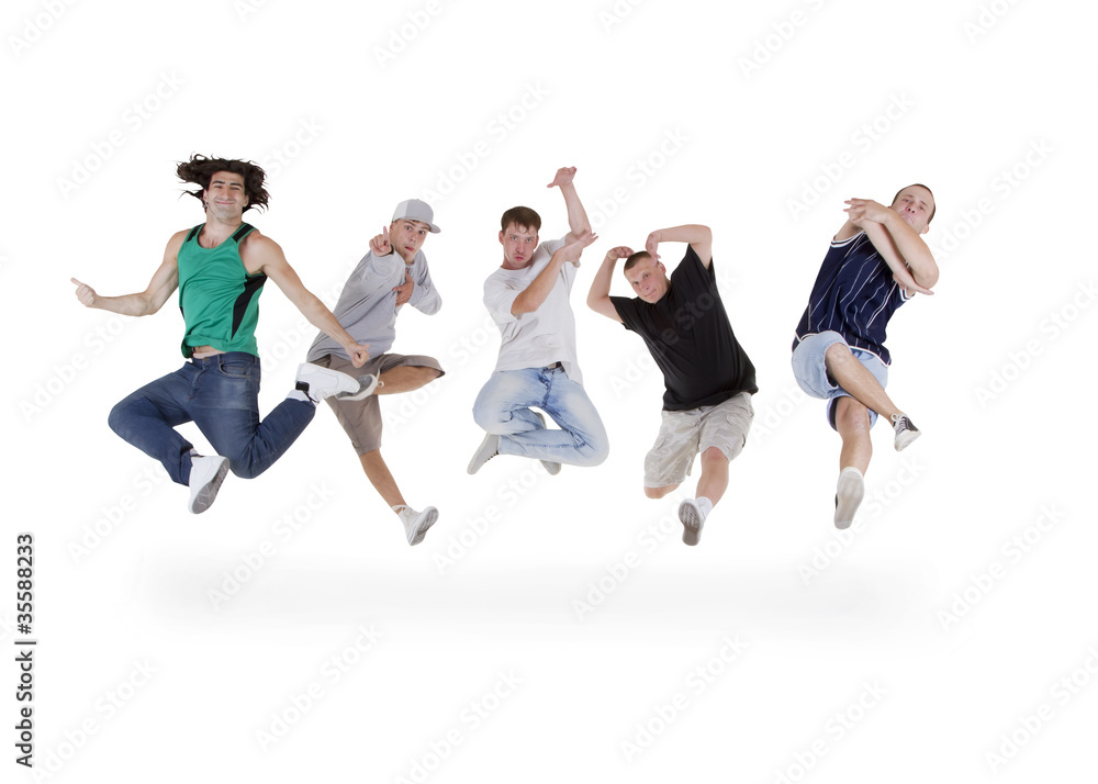 Group of young teenagers jumping over white Group of young teenagers jumping over white