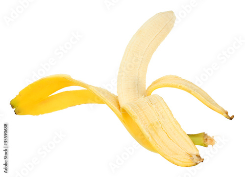 Single yellow banana and peel