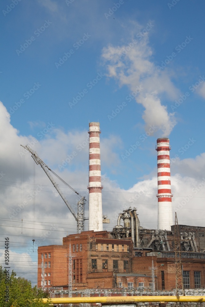 Factory with smoking chimneys