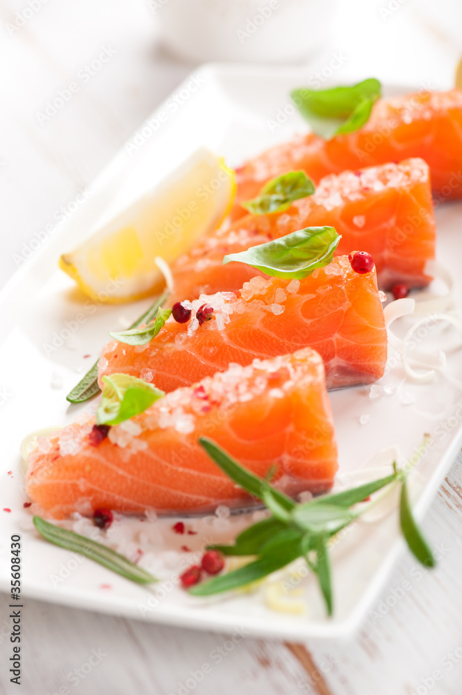 Fresh salmon with sea salt, pink pepper,rosemary and basil Fresh salmon with sea salt, pink pepper,rosemary and basil