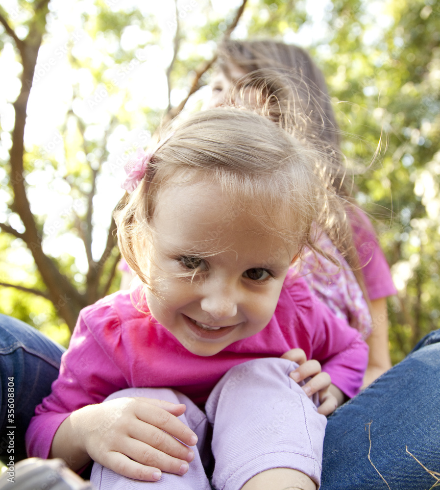 Little girl and mother in the park Little girl and mother in the park