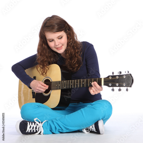 Pretty teenager girl music on acoustic guitar