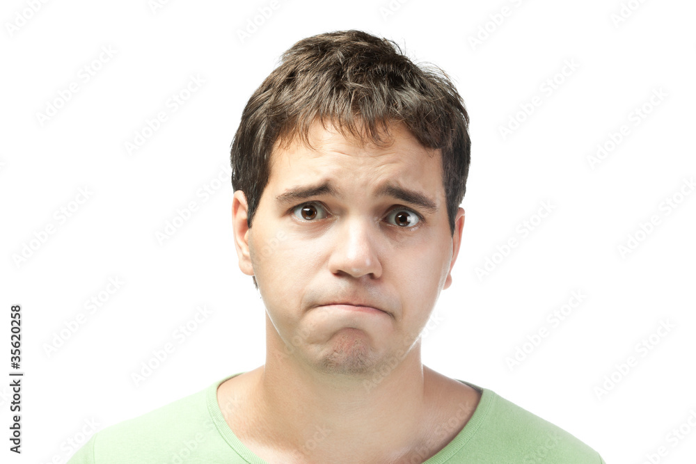 portrait of pitiful young man isolated on white background portrait of pitiful young man isolated on white background