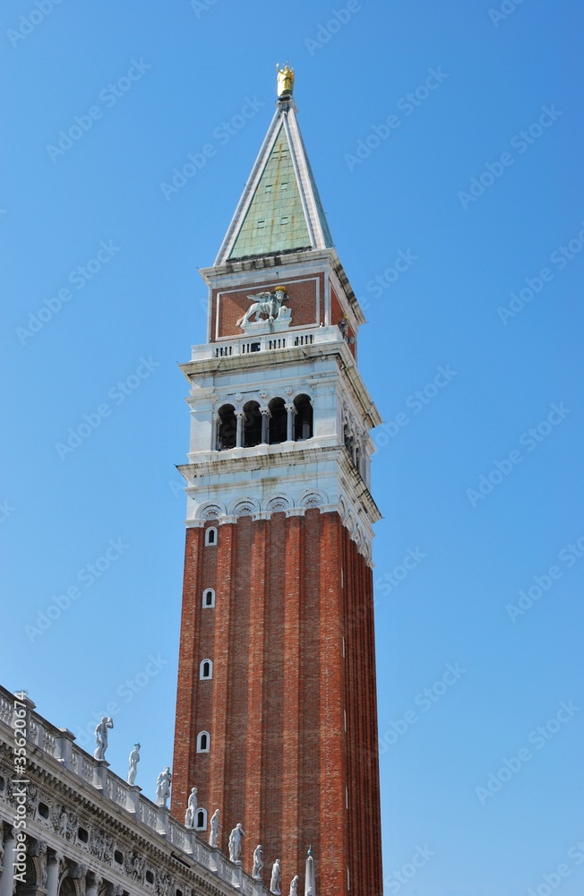 Famous St. Mark's tower bell on blue sky, Venice, Italy