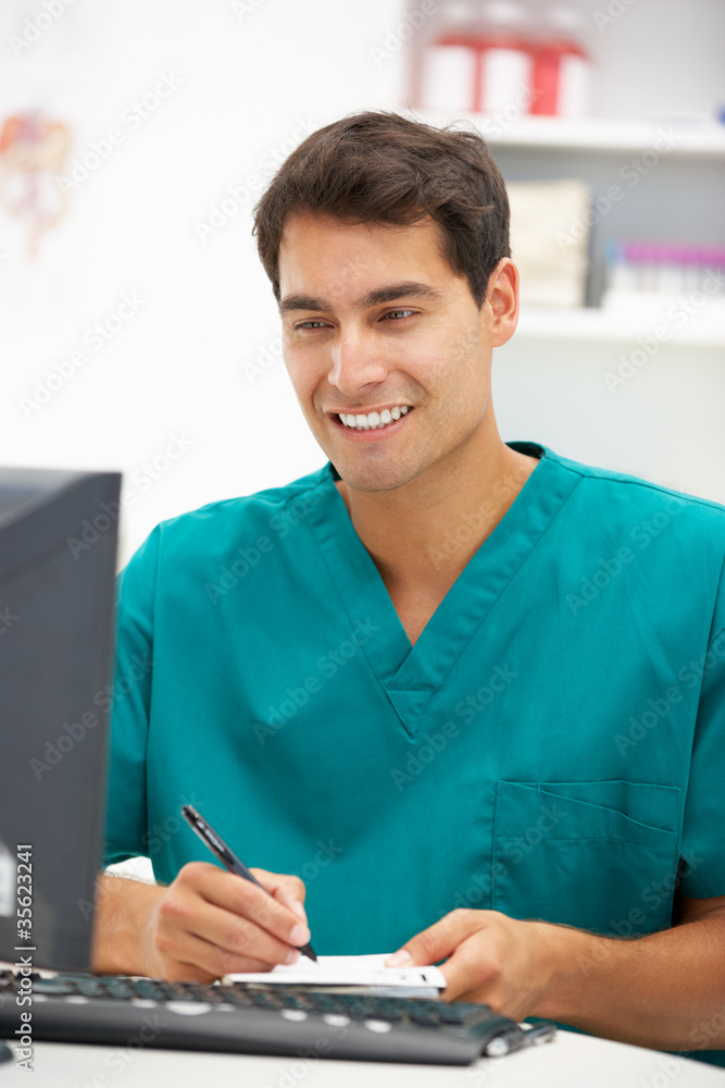 Young hospital doctor at desk