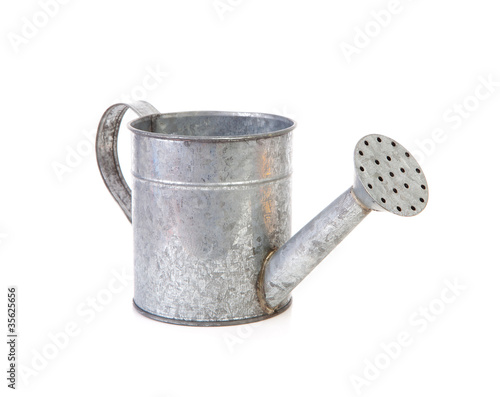 iron watering can over white background photo