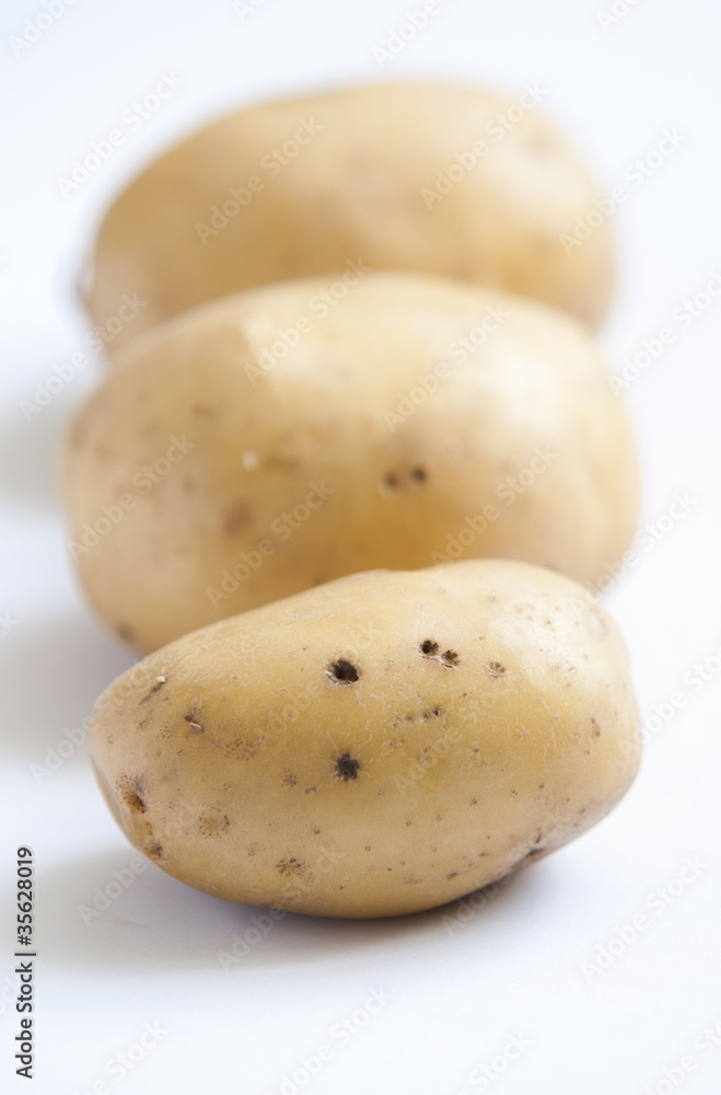 bunch of potatoes on white background close up shoot bunch of potatoes on white background close up shoot