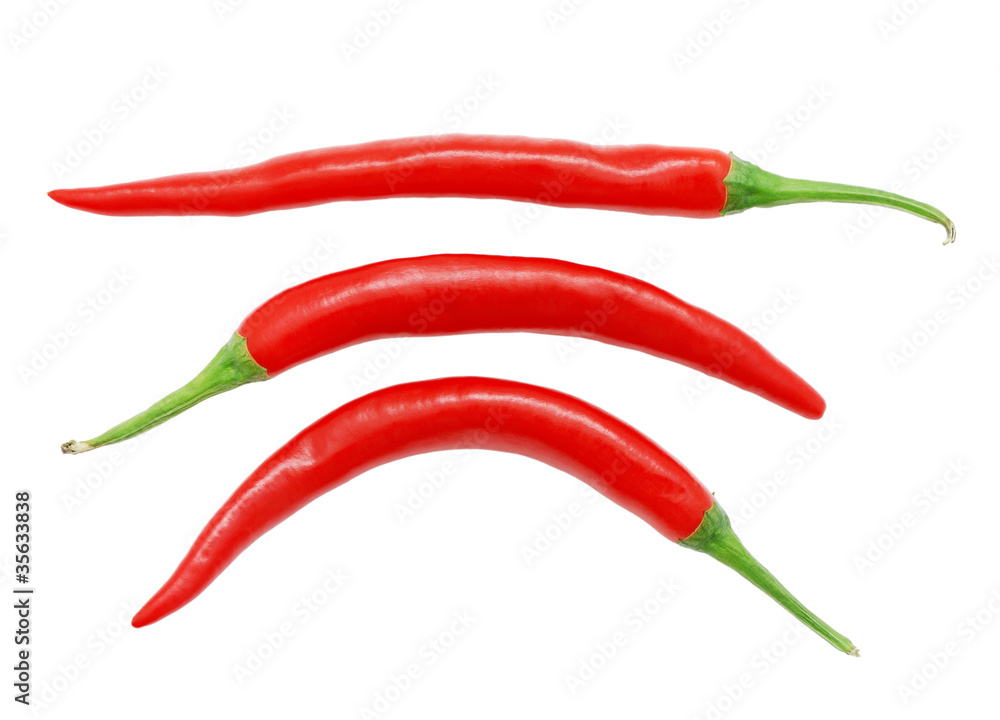 Three red hot chili peppers isolated on white background Three red hot chili peppers isolated on white background