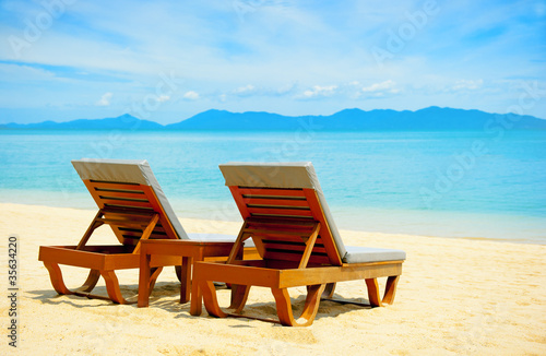 Chairs on the beach near sea © Andrii Vergeles