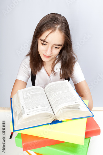 schoolgirl reads the book