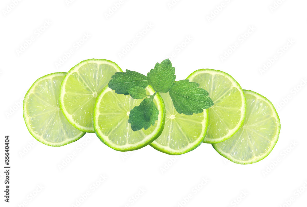Fresh juicy lime slices and mint leaves isolated on white