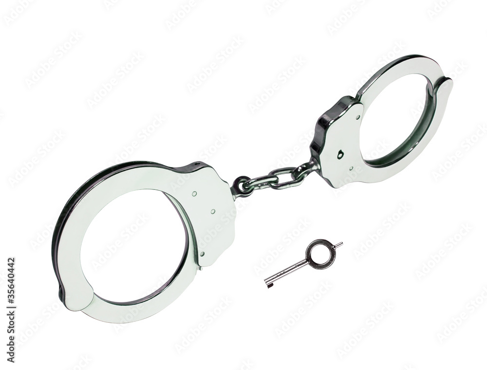 metal handcuffs with key isolated on white background metal handcuffs with key isolated on white background