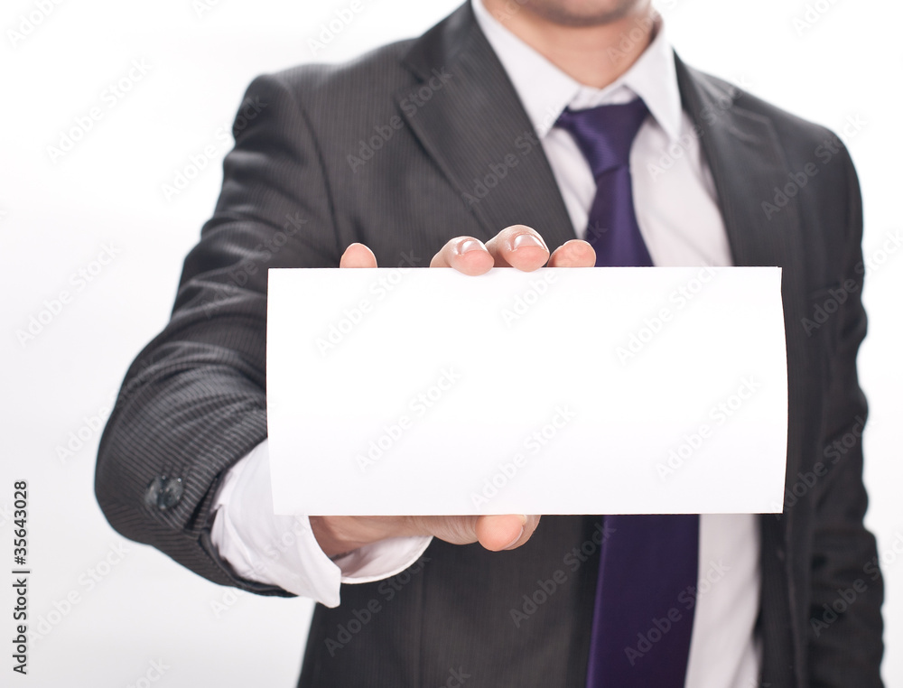 Closeup of businessman's hand holding up card on white Closeup of businessman's hand holding up card on white