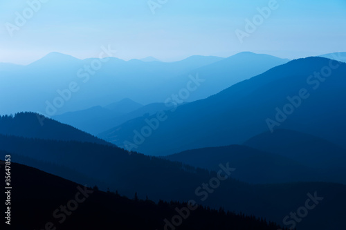 Fototapeta Naklejka Na Ścianę i Meble -  blue color of mountains during sunset
