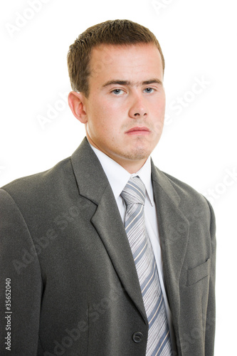 Serious businessman on white background.