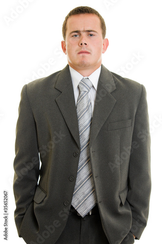 Serious businessman on white background.