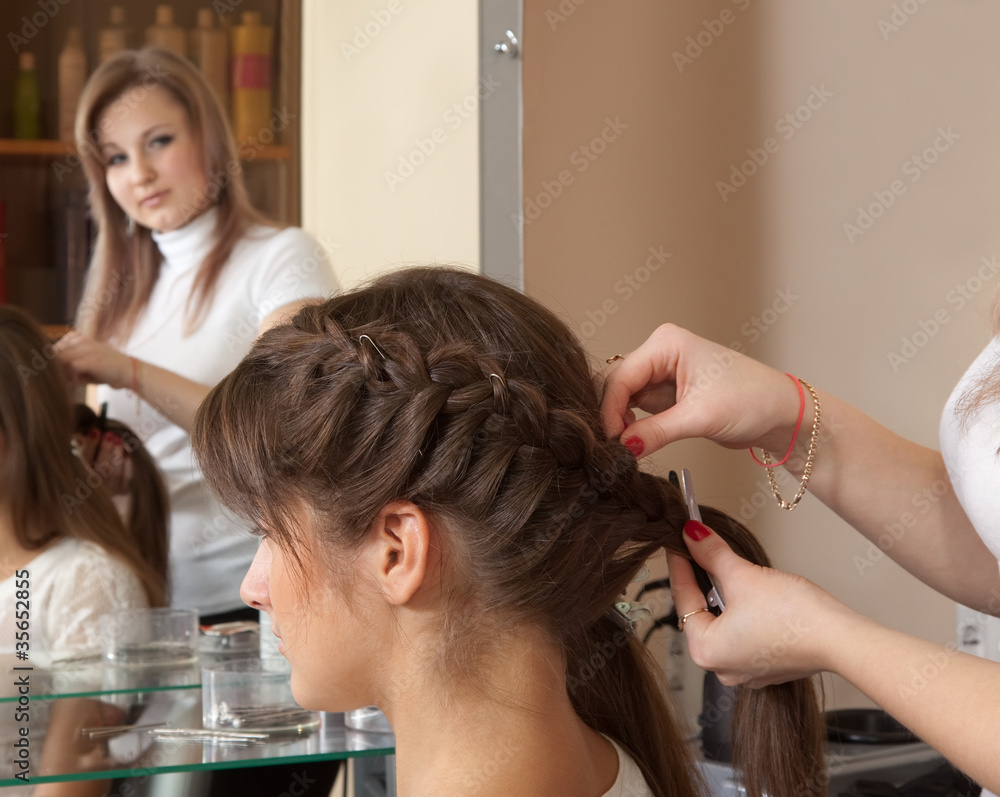 Fototapeta premium hairdresser working with long-hair