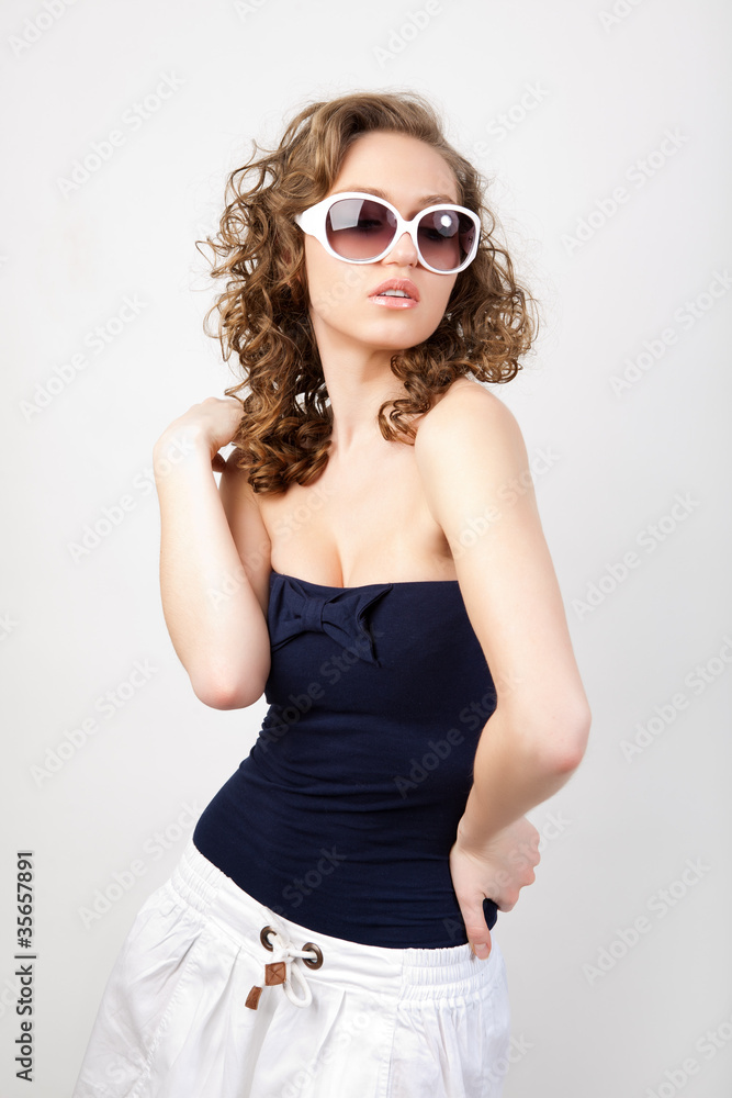 Girl in white sunglasses. Girl in white sunglasses.