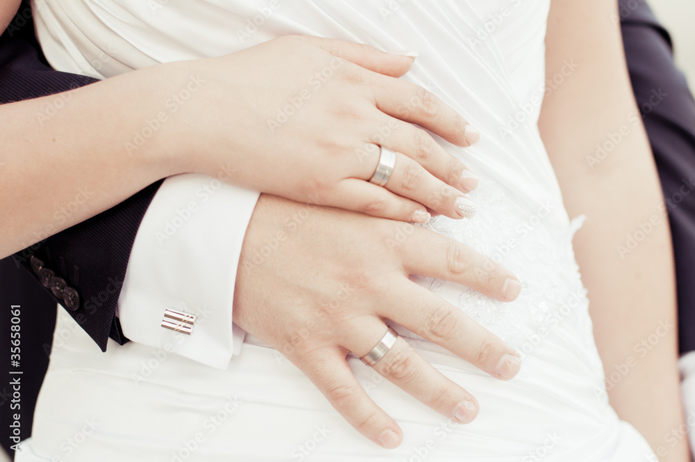 Hands and wedding rings