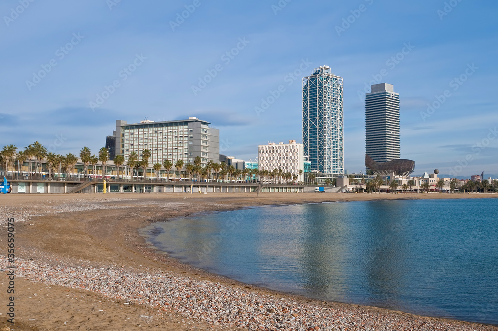 Naklejka premium Barceloneta Beach near Port Olimpic area in Barcelona, Spain