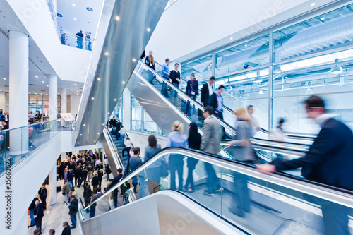 trade fair staircase with blurred people photo