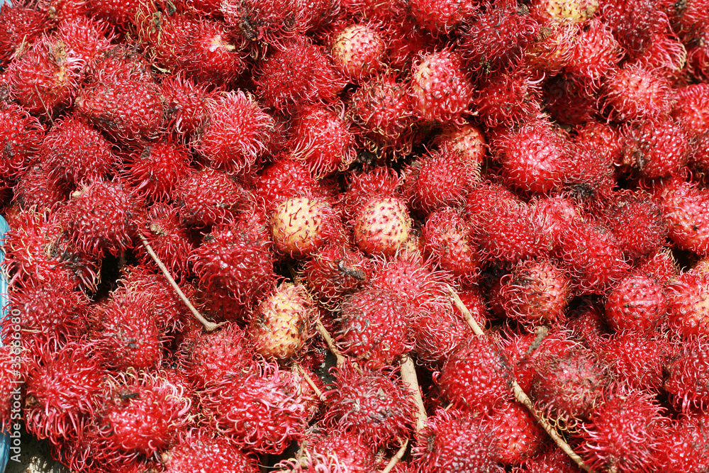 rambutan background, a tropical fruit rambutan background, a tropical fruit