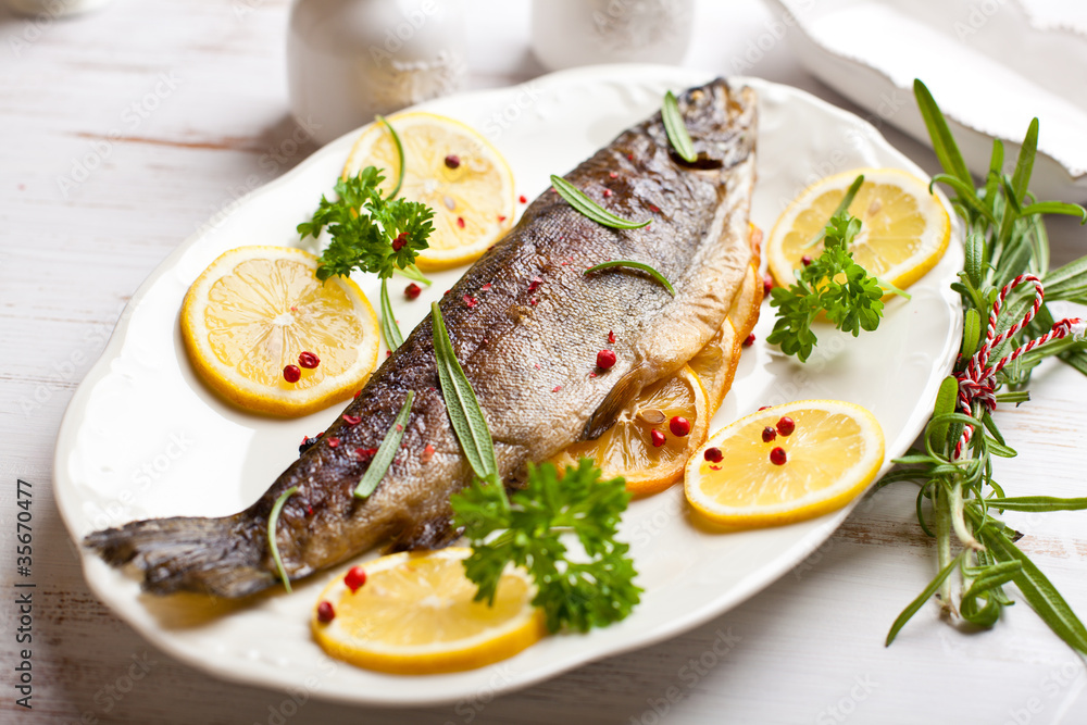 Oven baked trout with lemons and rosemary Oven baked trout with lemons and rosemary