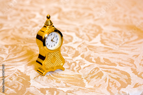 Miniature gold clock