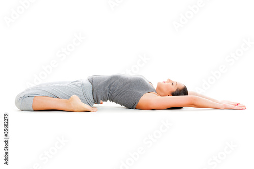woman doing yoga exercise on white floor