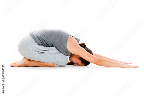 woman doing yoga workouts on floor