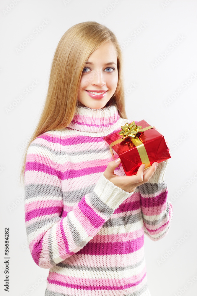 Attractive girl with gift box on gray Attractive girl with gift box on gray